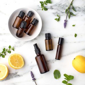 lemons, lavender, and essential oil bottles