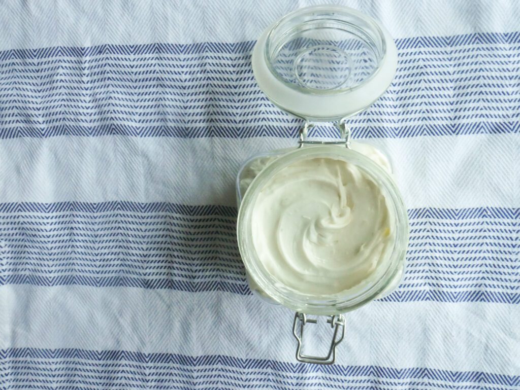 homemade whipped shea butter lotion in glass jar