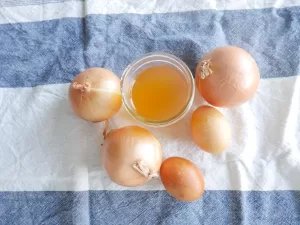 natural easter egg dye using onion skins next to naturally dyed easter eggs