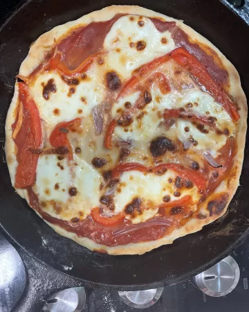sourdough pizza in a cast iron skillet
