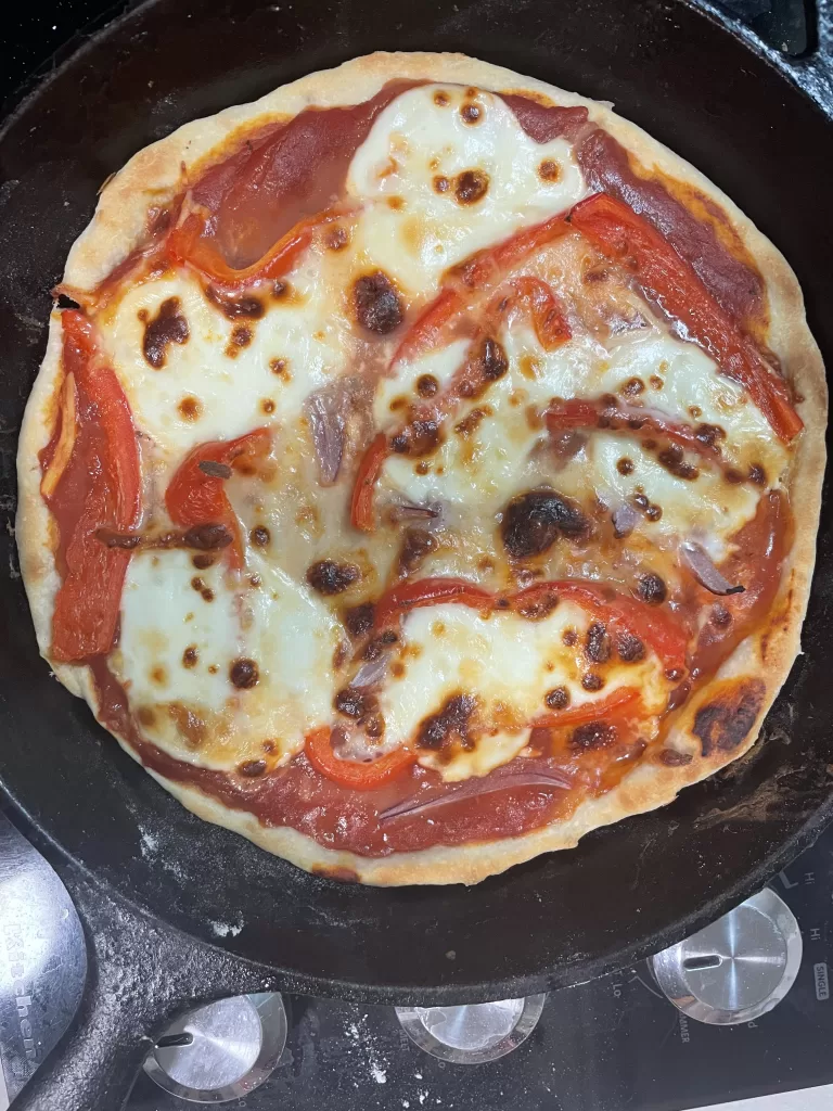 sourdough pizza in a cast iron skillet