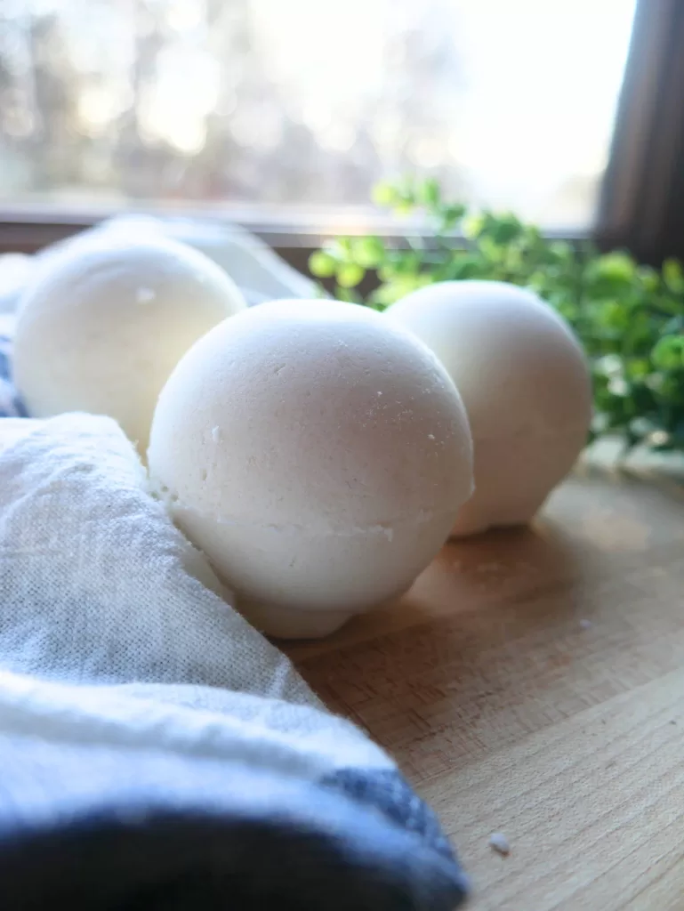 3 diy bath bombs on cutting board