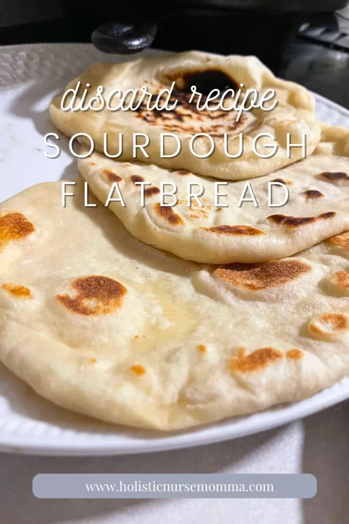 sourdough flatbreads sitting on a white plate in a row