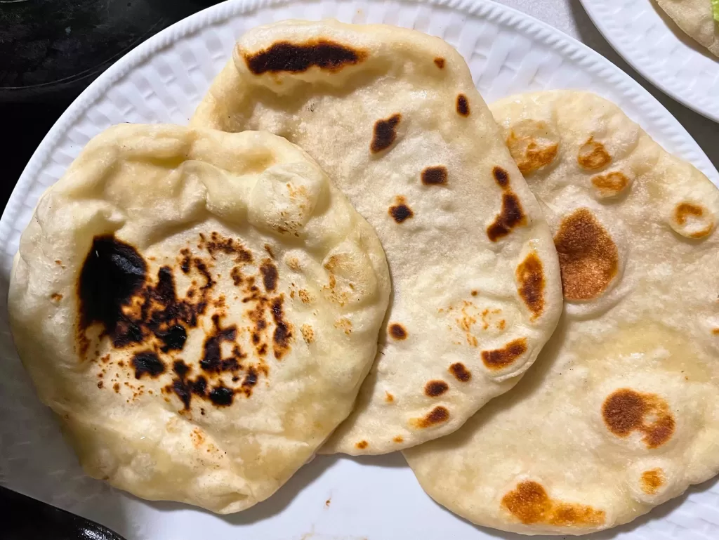 3 sourdough flatbreads laying on a plate