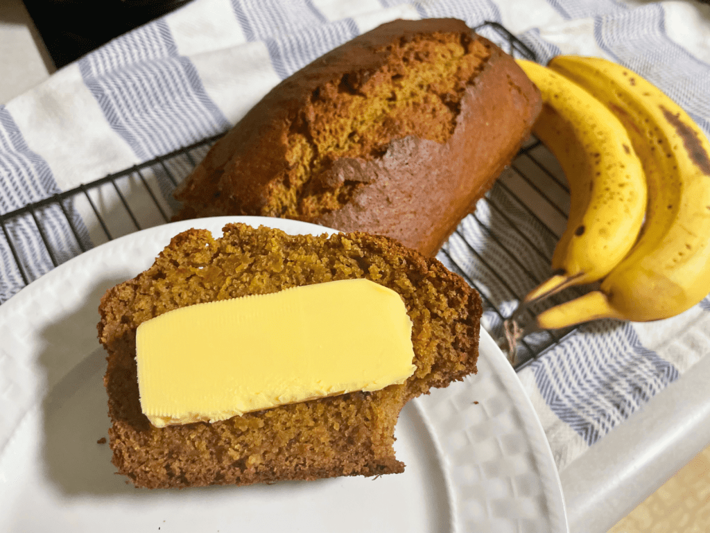 a slice of sourdough banana bread with butter