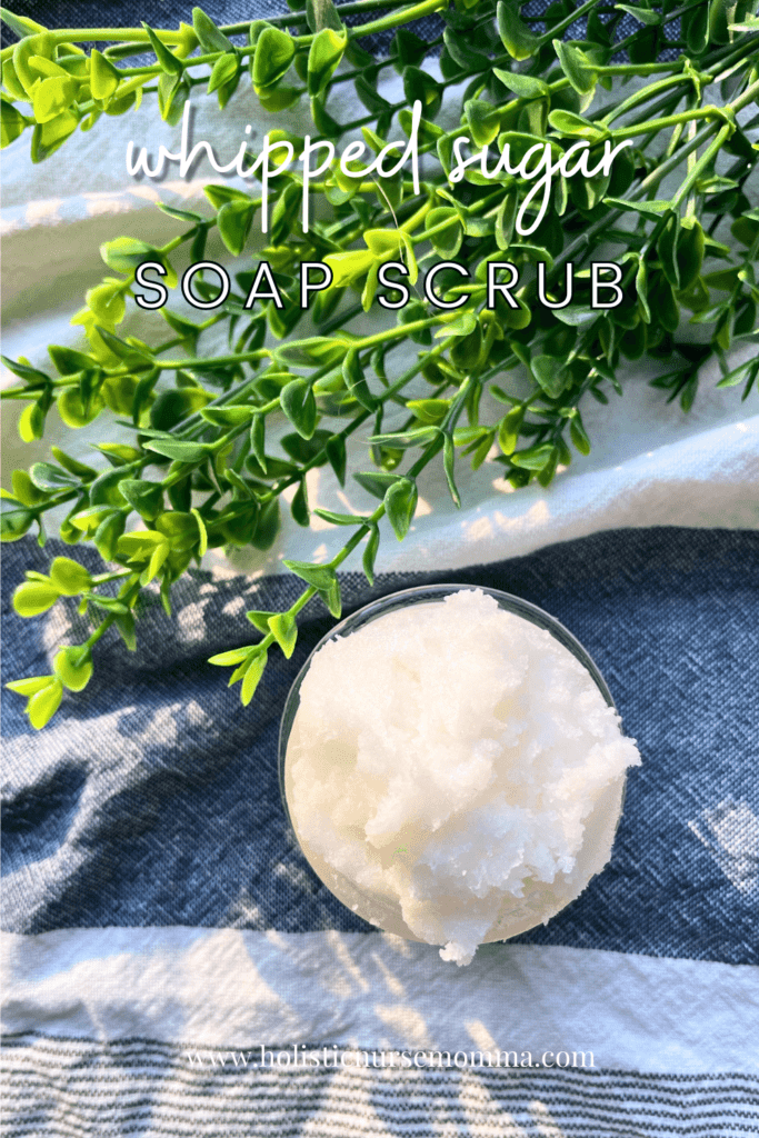 whipped sugar soap scrub sitting next to green leaves