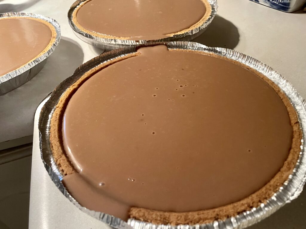 from scratch chocolate pudding in a graham cracker pie crust