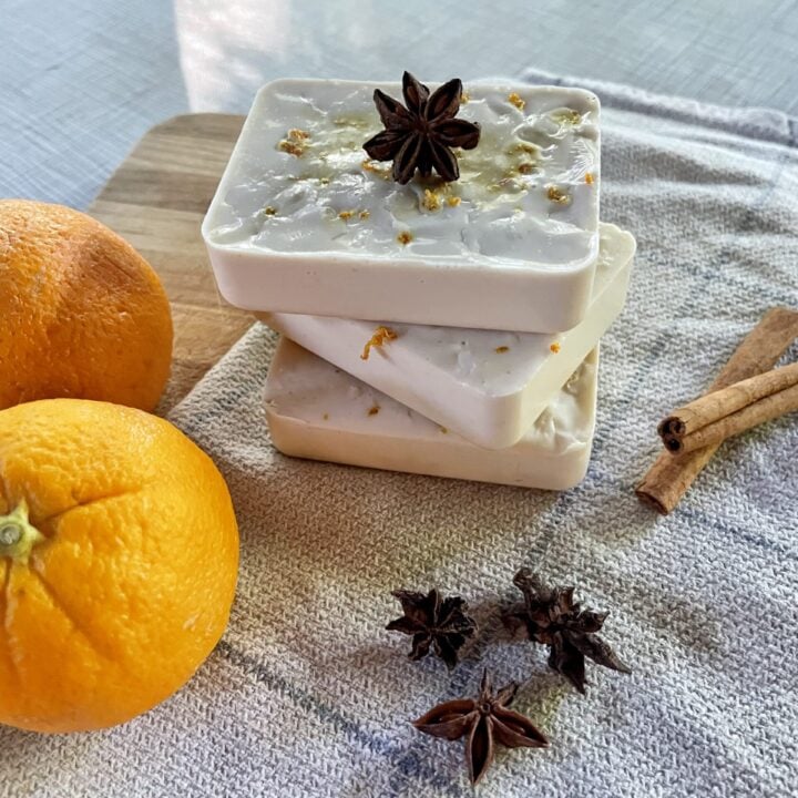 fall soaps with orange zest stacked on white towel
