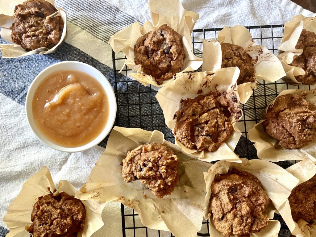 gluten free muffins on wire rack next to applesauce