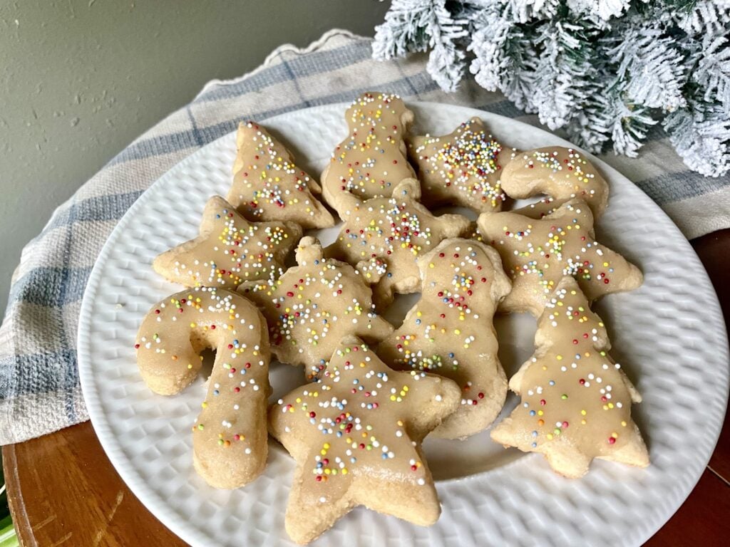 iced fresh milled flour sugar cookies on white plate