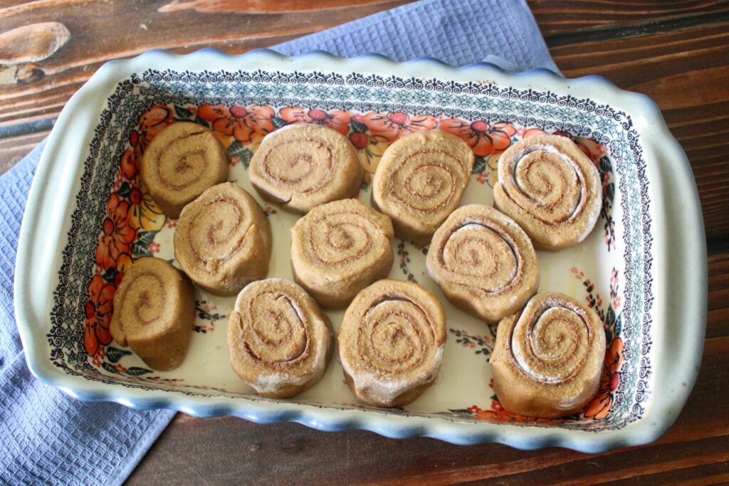 unbaked sourdough cinnamon rolls with fresh milled flour in a baking pan